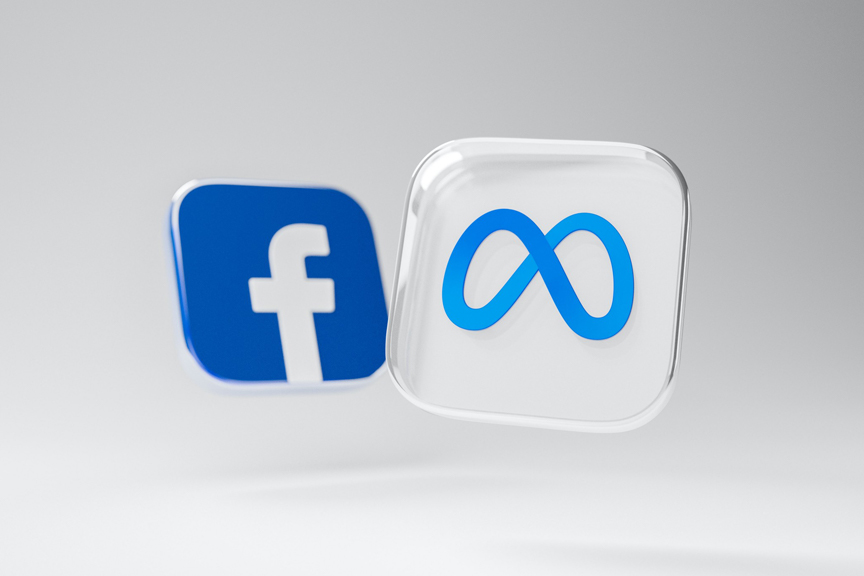 Two floating tiles in an empty, white, space. The foremost tile features the Meta Inc. logo. The out of focus tile features the Facebook logo.